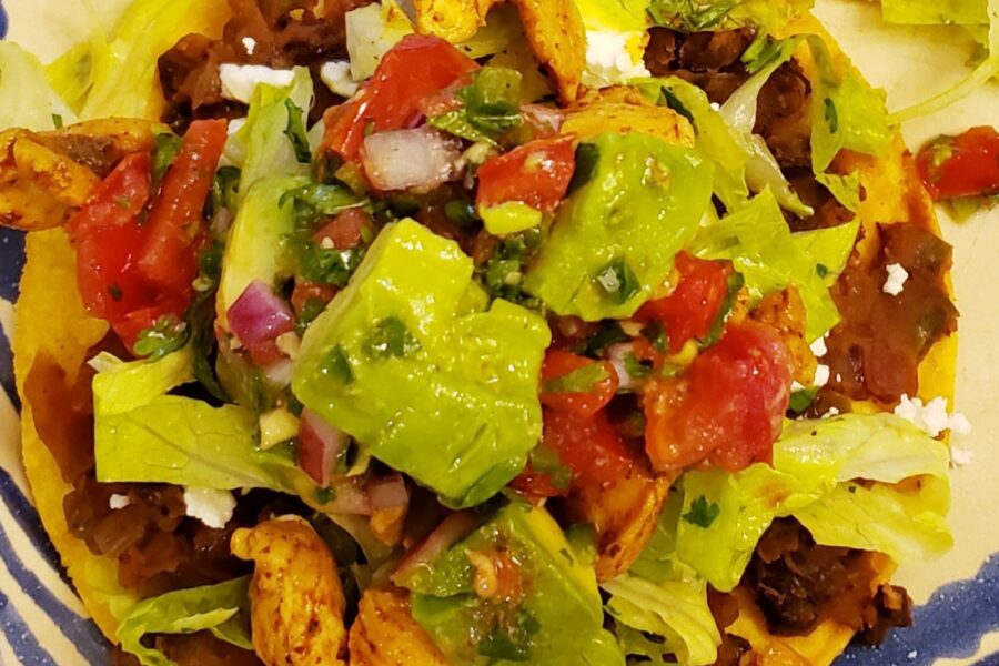 Tostadas with Spicy Chicken, Black Beans, Goat Cheese, and Avocado Enhanced Pico de Gallo